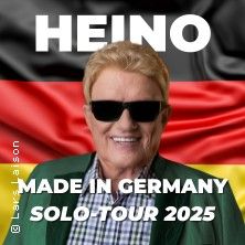 Ein Mann mit Sonnenbrille vor einer deutschen Flagge, Text: Heino Made in Germany Solo Tour 2025.
