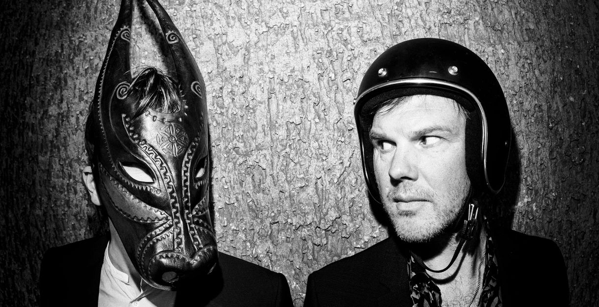 On the left a personwith a mask, on the right a person with a helmet.